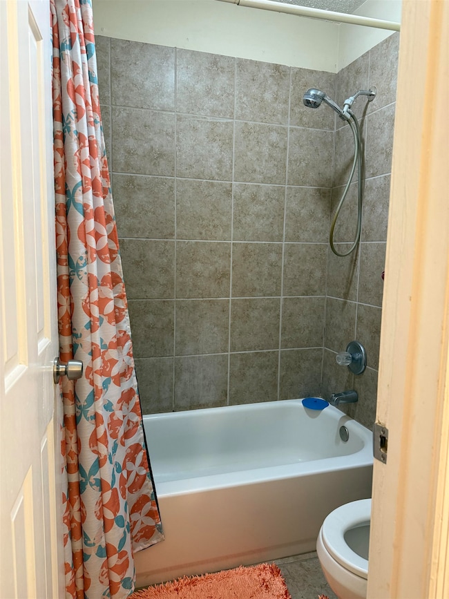 Bathroom featuring tile patterned floors, shower /