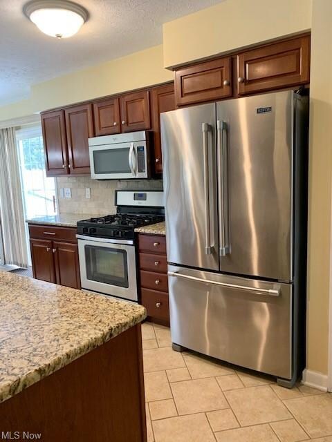 Kitchen has Stainless appliances-all stay, and new