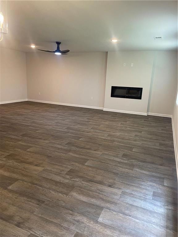 Unfurnished living room featuring visible vents, b