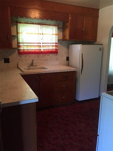 Kitchen with full refrigerator