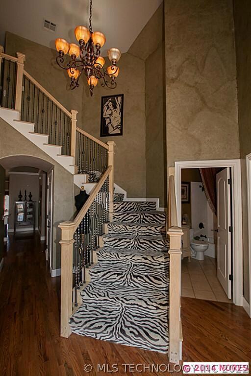 Stunning Staircase in Entry with designer carpet