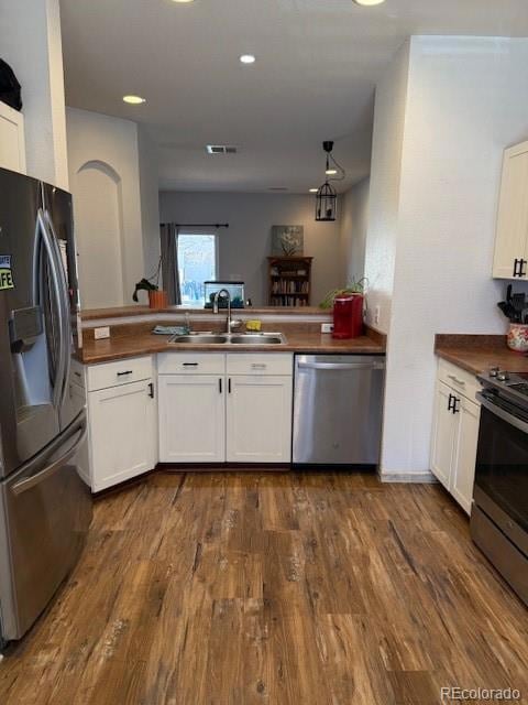 SS Appliances Open to Living Dining and Living Space