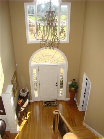 Beautiful Foyer and wooden staircase.