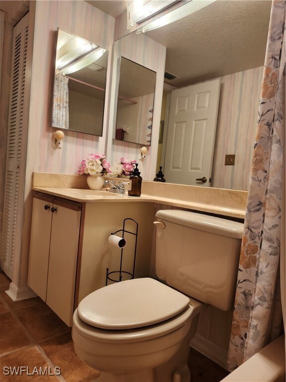 Bathroom with tile patterned flooring, vanity, a s