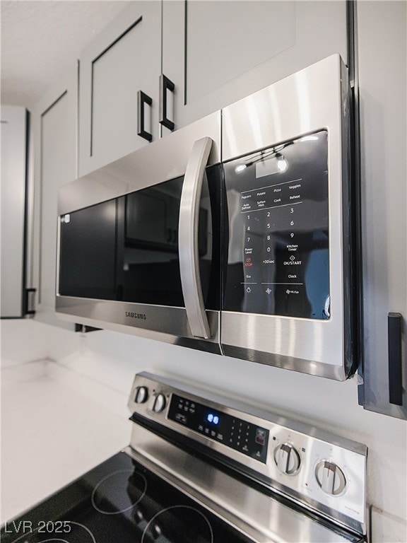 Kitchen view of appliances with stainless steel fi