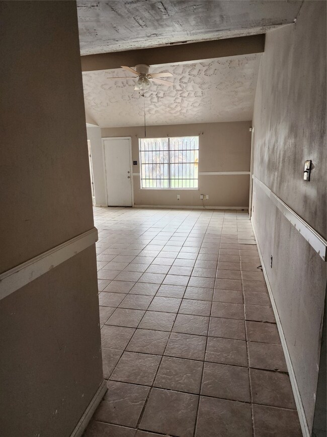 View from entry through dining area to family area