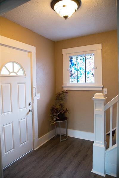 Entrance with new flooring and fresh paint.