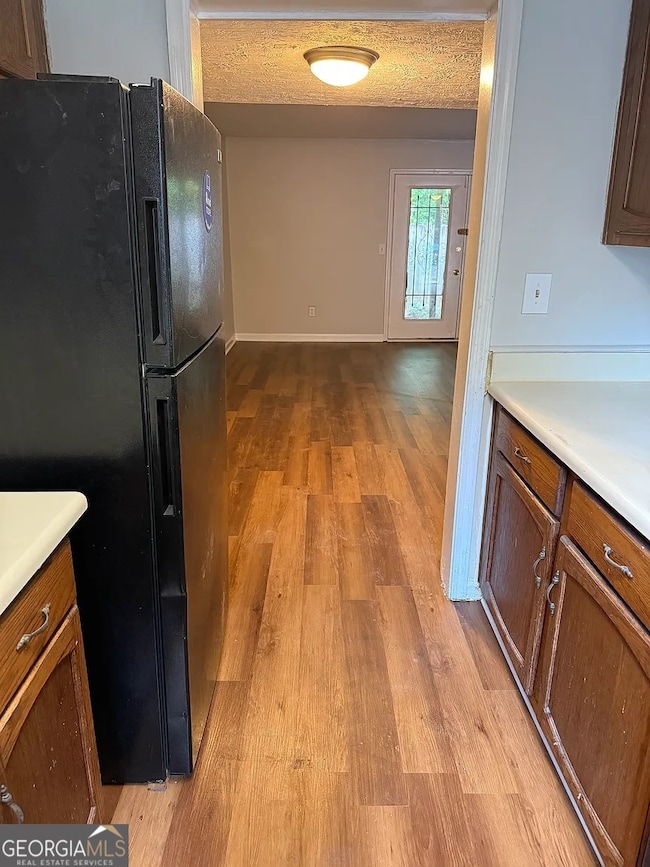 Large window over the sink provides natural light and a pleasant backyard view.