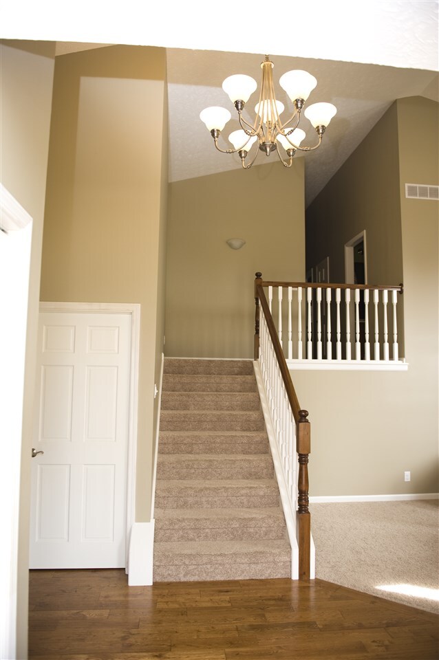 2 Story entry; oak floors and 2-tone spindled hand