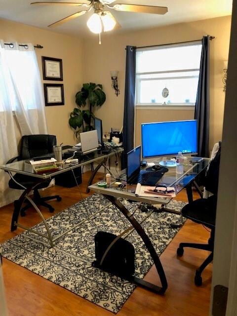 SECOND BEDROOM BEING USED AS AN AT HOME OFFICE.NICE WOOD LAMINATE FLOORS
