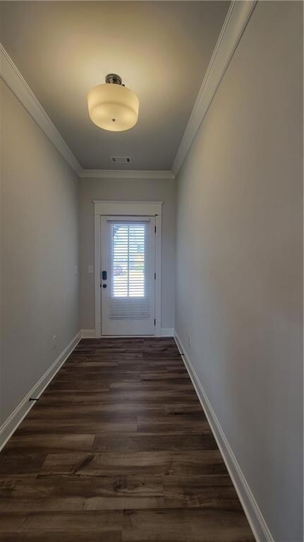 Doorway to outside featuring dark hardwood / wood-