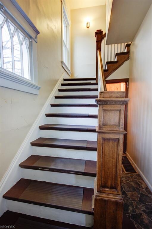 Stairway to 2nd floor unit. Beautiful wood baniste