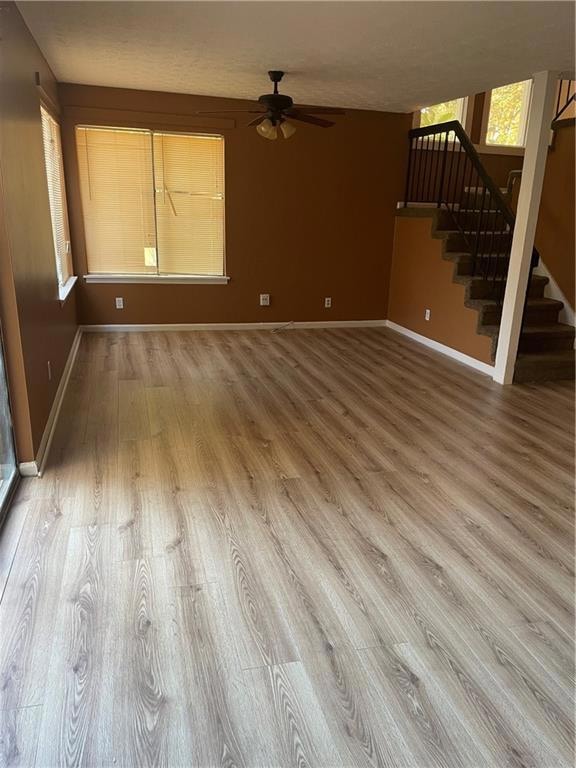 Unfurnished living room featuring hardwood / wood-