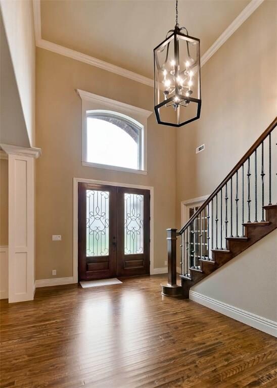 Grand entry features arched windows, beautifully s