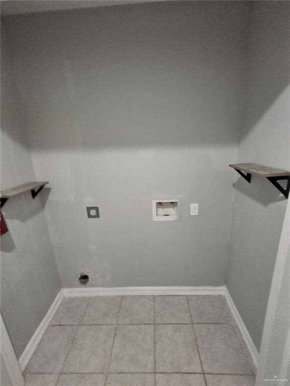 Washroom featuring light tile patterned flooring, washer hookup, and electric dryer hookup
