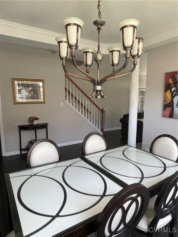 Dining space featuring crown molding