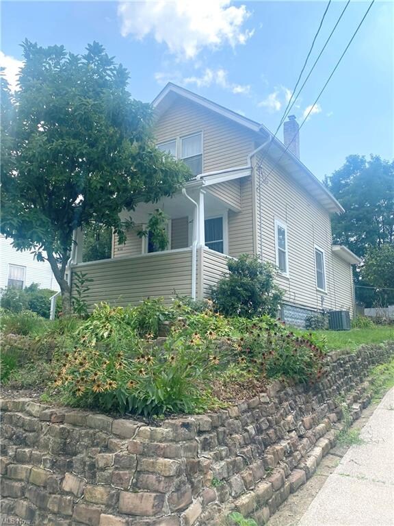 FRONT VIEW 3 WITH MATURE LANDSCAPING.