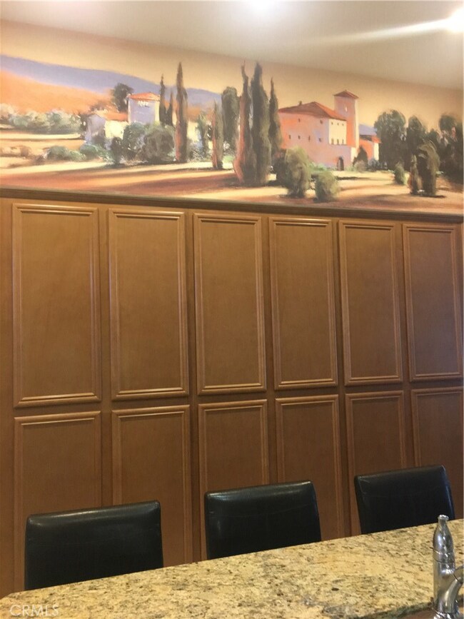 Loads of kitchen storage, custom painted canvas above the kitchen cabinetry