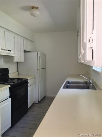 Kitchen has lots of counter space and cabinets