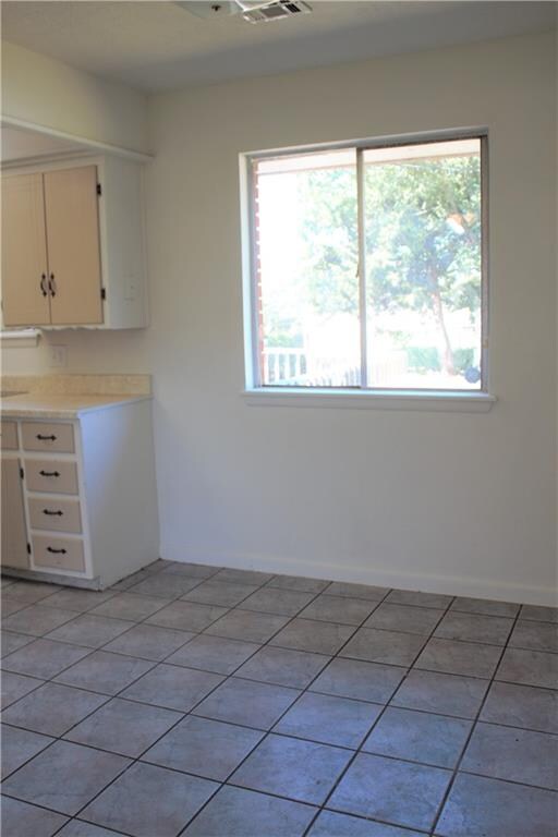 Dining room has tile floors, large window for view