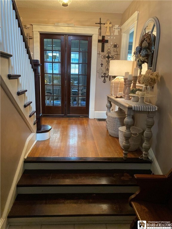 Entry  looking into dining room with pocket doors