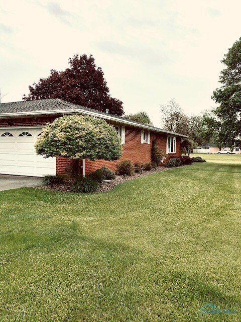 Side view of home facing Hubbard Street. Includes