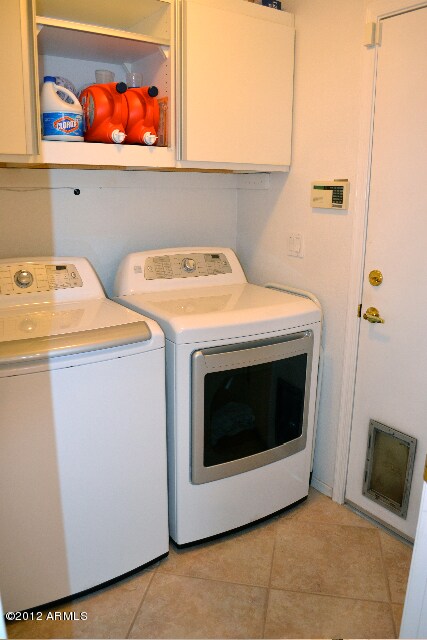 Laundry with custom cabinets