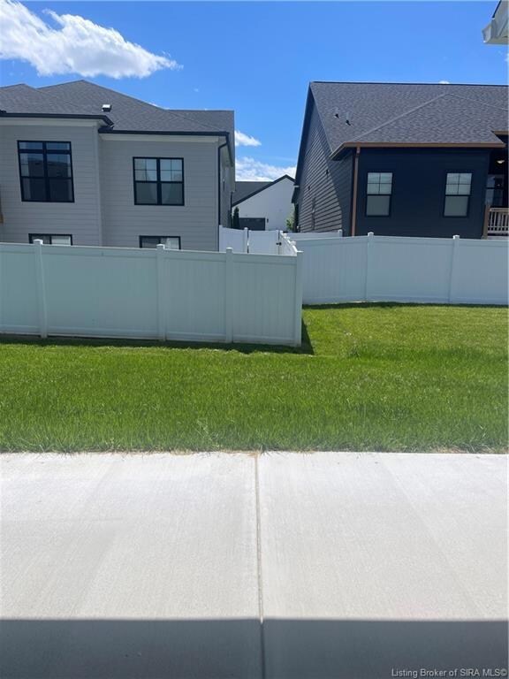 Rear view off concrete covered patio