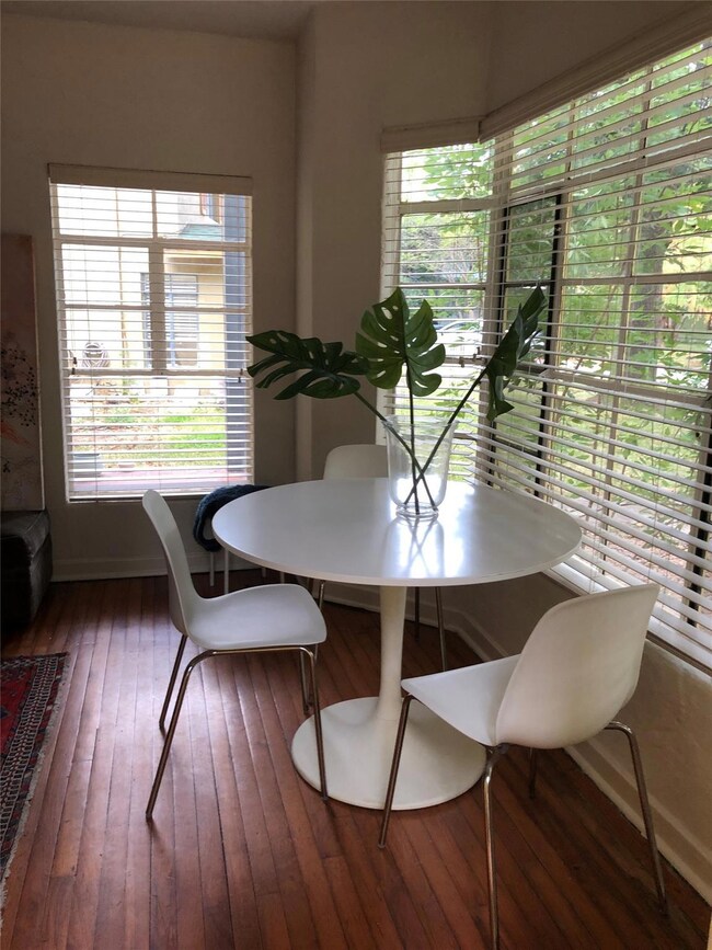 Dining space with wood-type flooring, healthy amo