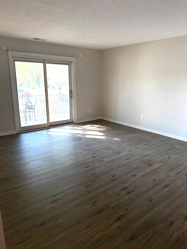 large living room with slider to balcony