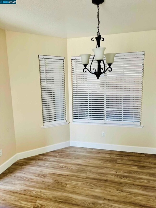 Newly painted with new light fixtures and new flooring.