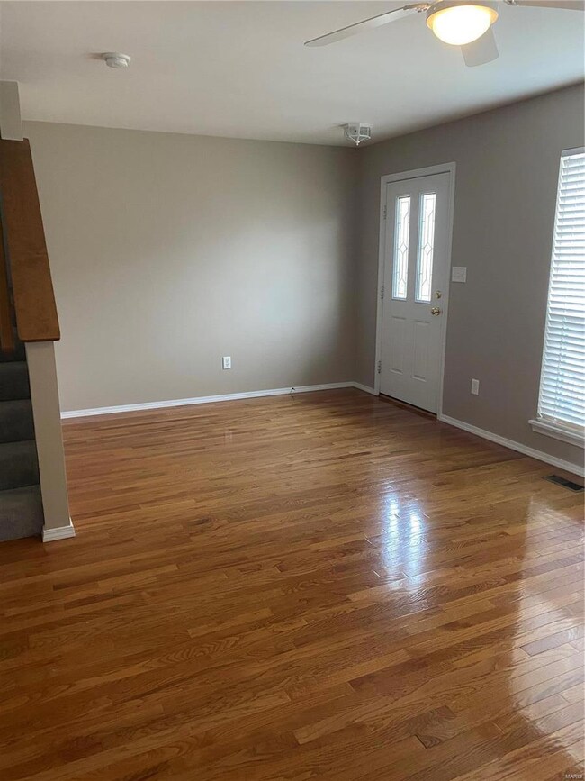Enter into spacious living room with gleaming hard