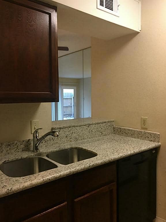 On the right is the kitchen, granite counters, stainless steel sink, beautiful stainless steel faucet!