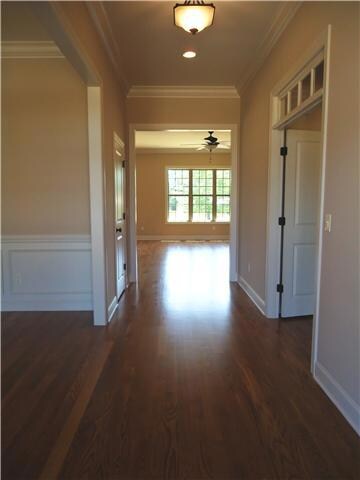 A large foyer welcomes guests to this gracious home. The dining room is located to the left and a second master suite is located to the right.