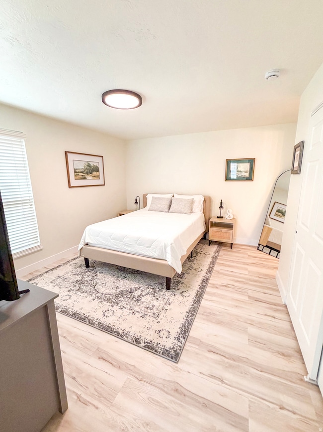Bedroom featuring light wood-style flooring