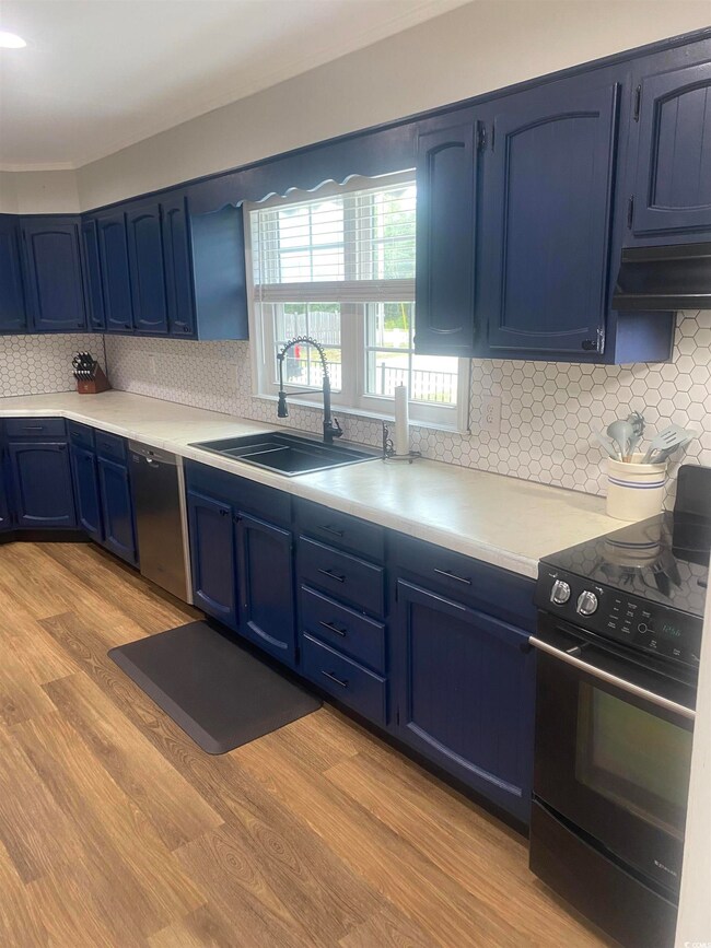 Kitchen featuring light hardwood / wood-style floo
