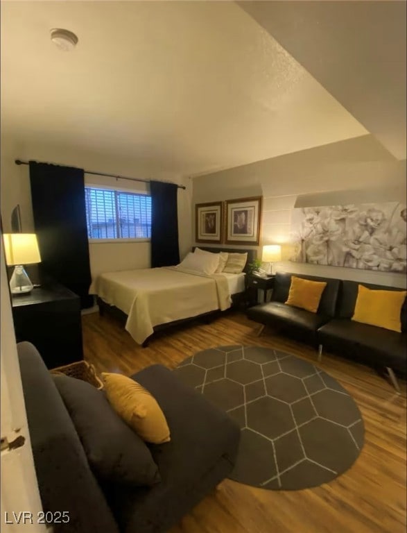 Bedroom featuring wood finished floors