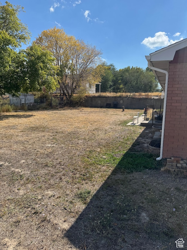 View of yard with a patio