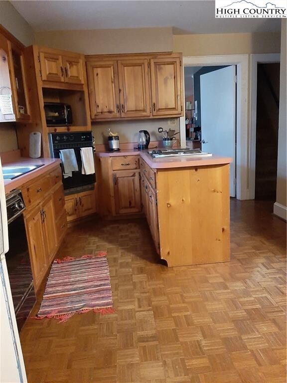 Kitchen with oak cabinets.
