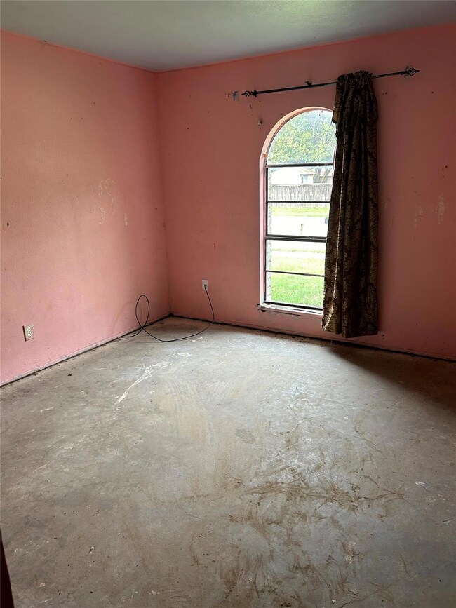 Spare room featuring concrete floors