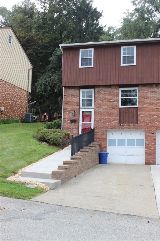 New concrete walkway, retaining wall and metal rai