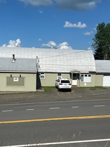 Commercial space and 1 apartment with 2 car garage