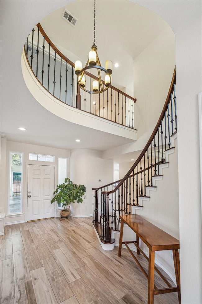 GRAND ENTRANCE OFFERS A SOARING 2-STORY CEILING, S