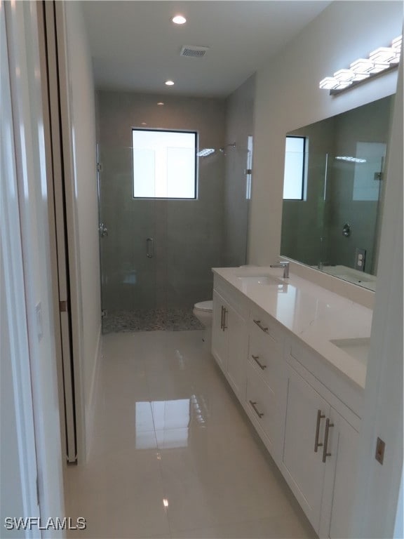 Full bath featuring a stall shower, tile patterned