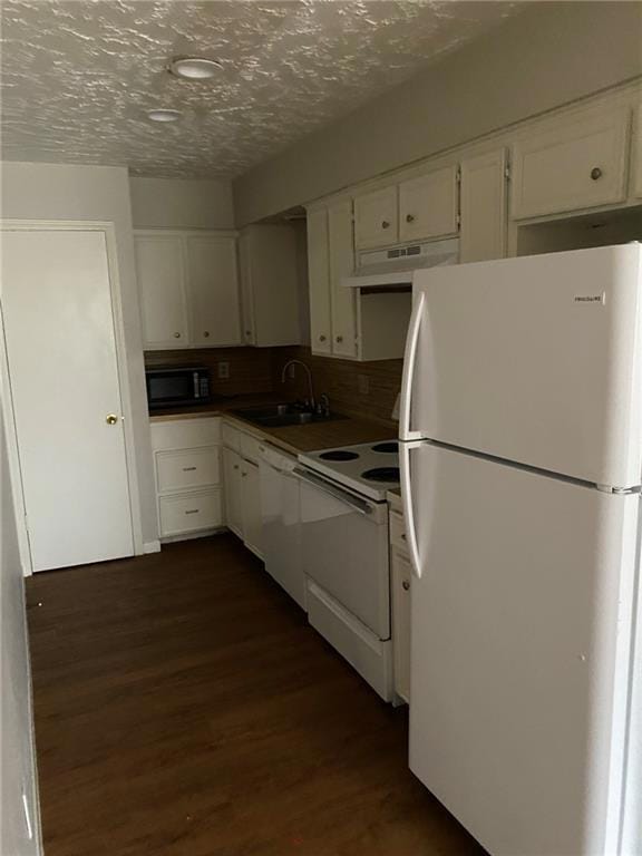 Kitchen featuring white appliances, under cabinet