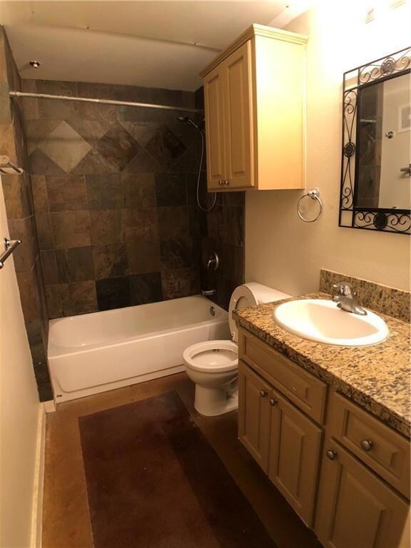 Full bathroom featuring shower / bathtub combination and vanity