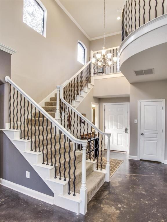 Gorgeous light, bright and open entryway with vaul