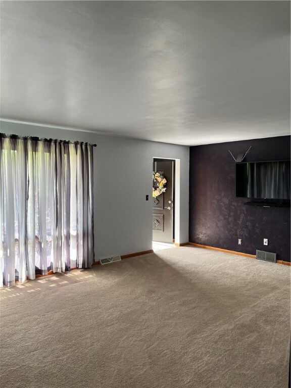 Front entrance opens to huge living room