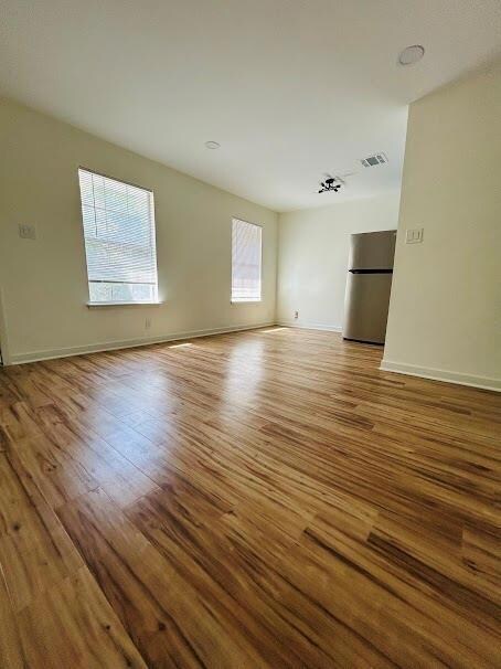 Unfurnished room featuring wood finished floors