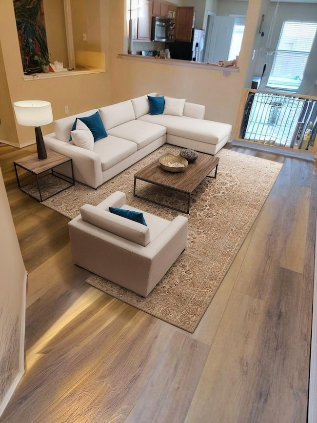 This inviting living area, which opens up to kitch